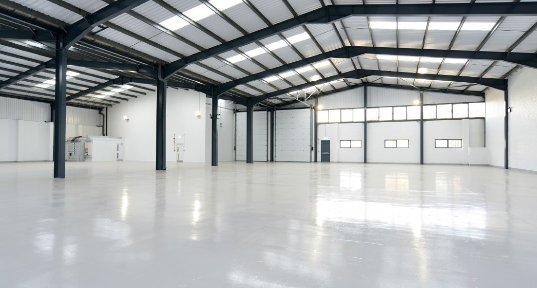 empty warehouse with light grey epoxy resin floor