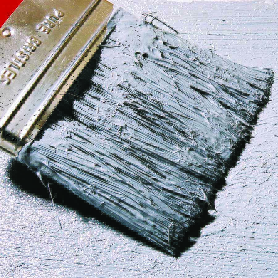 closeup of brush in white paint