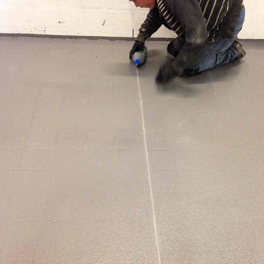 white sealant being poured