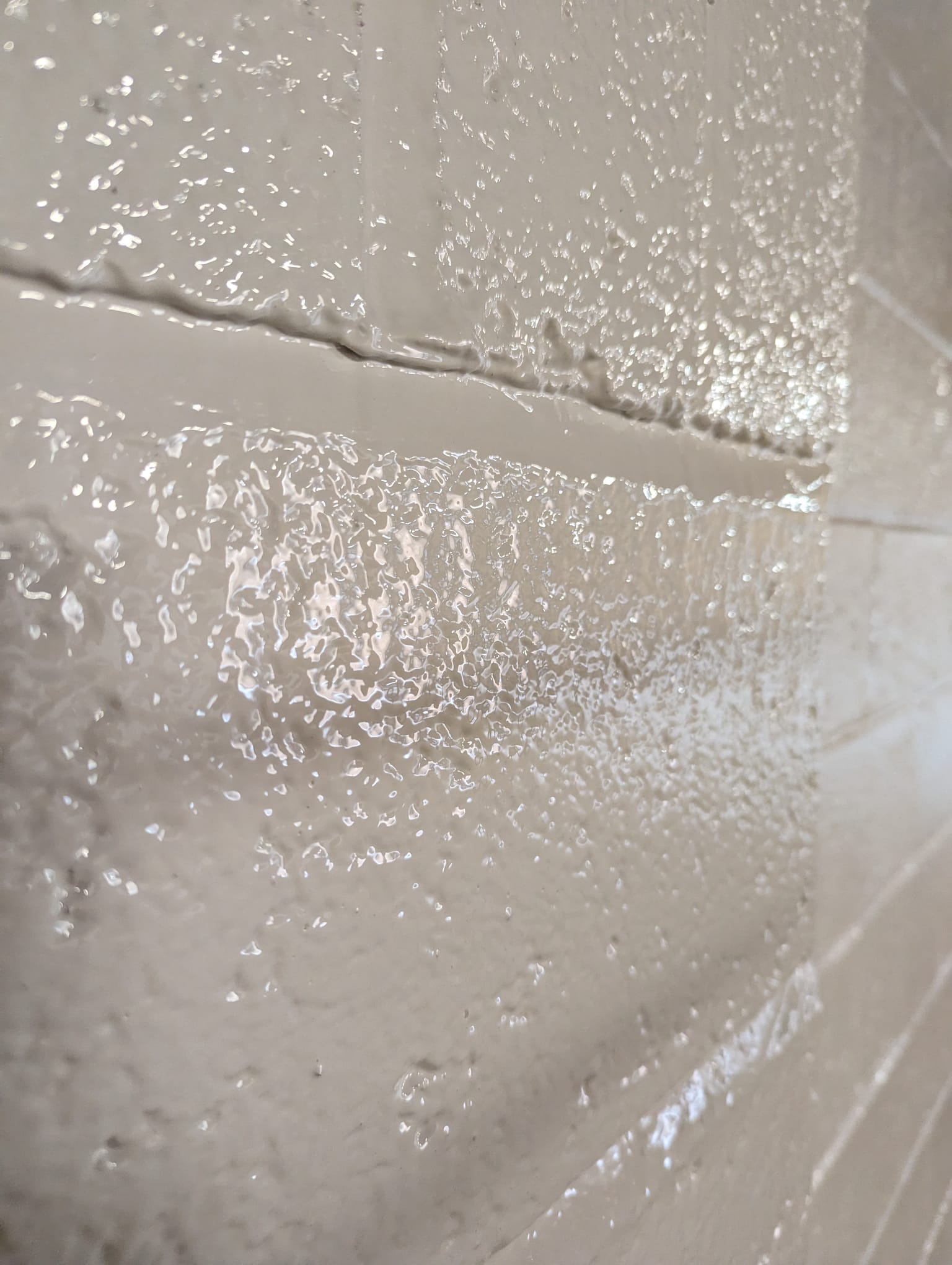 A close up of a breeze block completely sealed with white Hyglaze EP
